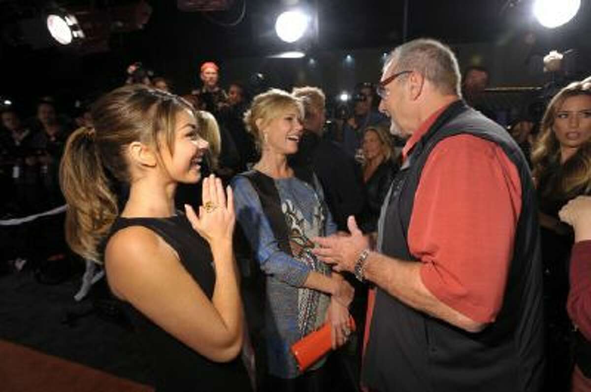 Cast members, from left, Sarah Hyland, Julie Bowen, and Ed O'Neill attend USA Network's "Modern Family" Fan Appreciation Day at the Westwood Village Theatre on Monday, Oct. 28, 2013 in Los Angeles.