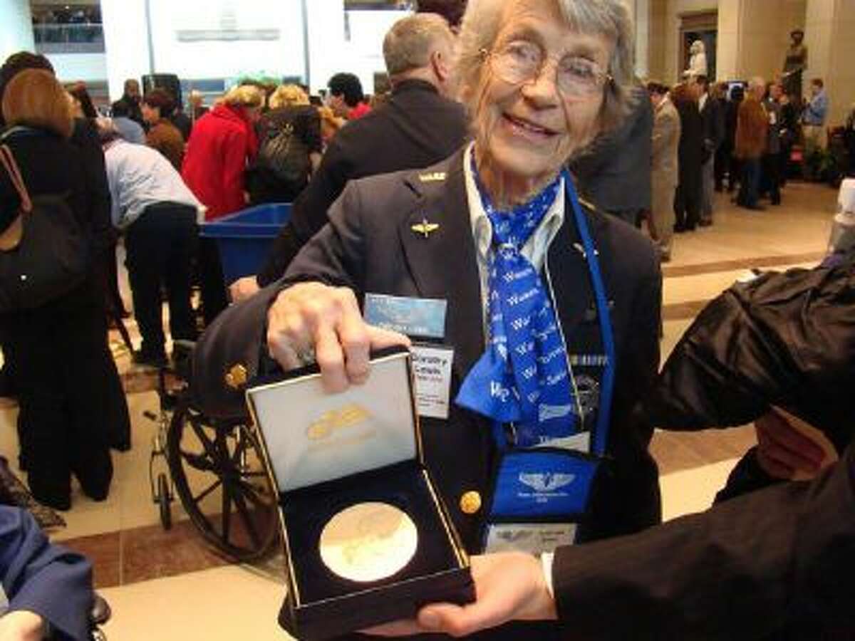 Dorothy "Dot" Lewis, seen 2010 in Washington with the Congressional Gold Medal she received, served in the Women's Airforce Service Pilots during World War II.