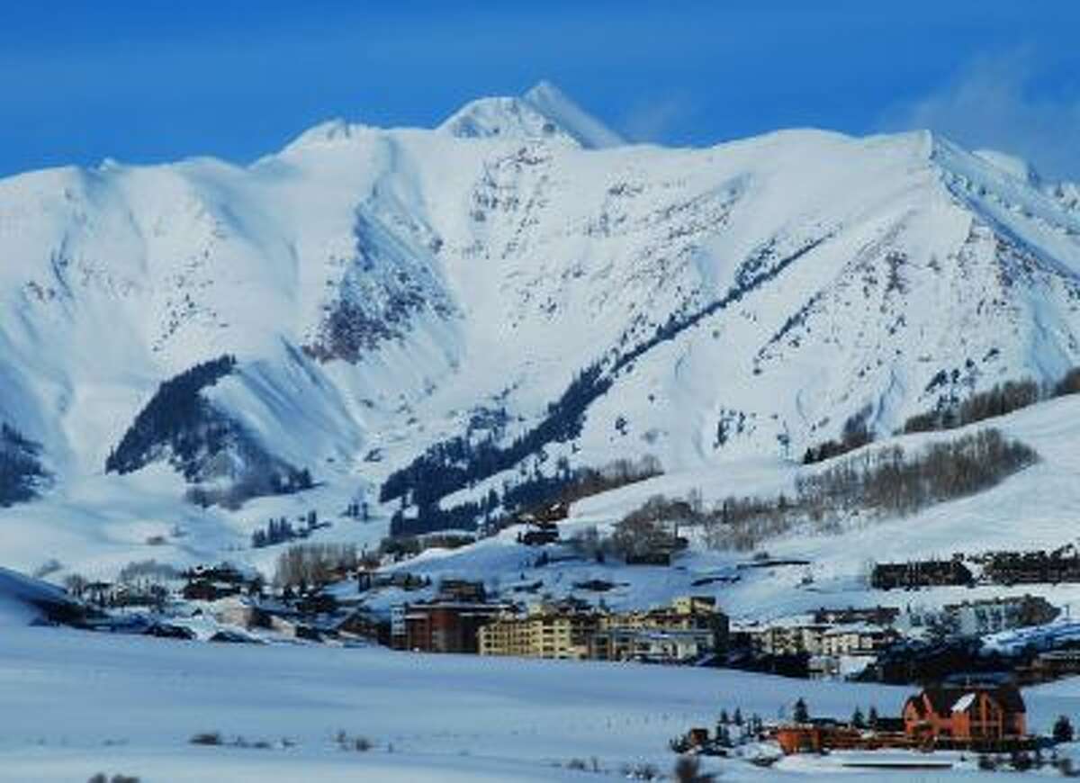 Crested Butte Mountain Resort's base area is dwarfed by the Elk Mountains. Crested Butte, Colo., is nestled among the snowiest peaks in Colorado. For residents and visitors, it's all about the snow.