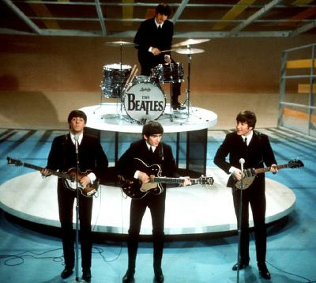 In this Feb. 9, 1964 photo, The Beatles, from left, Paul McCartney, George Harrison, Ringo Starr on drums, and John Lennon perform on the CBS "Ed Sullivan Show" in New York.
