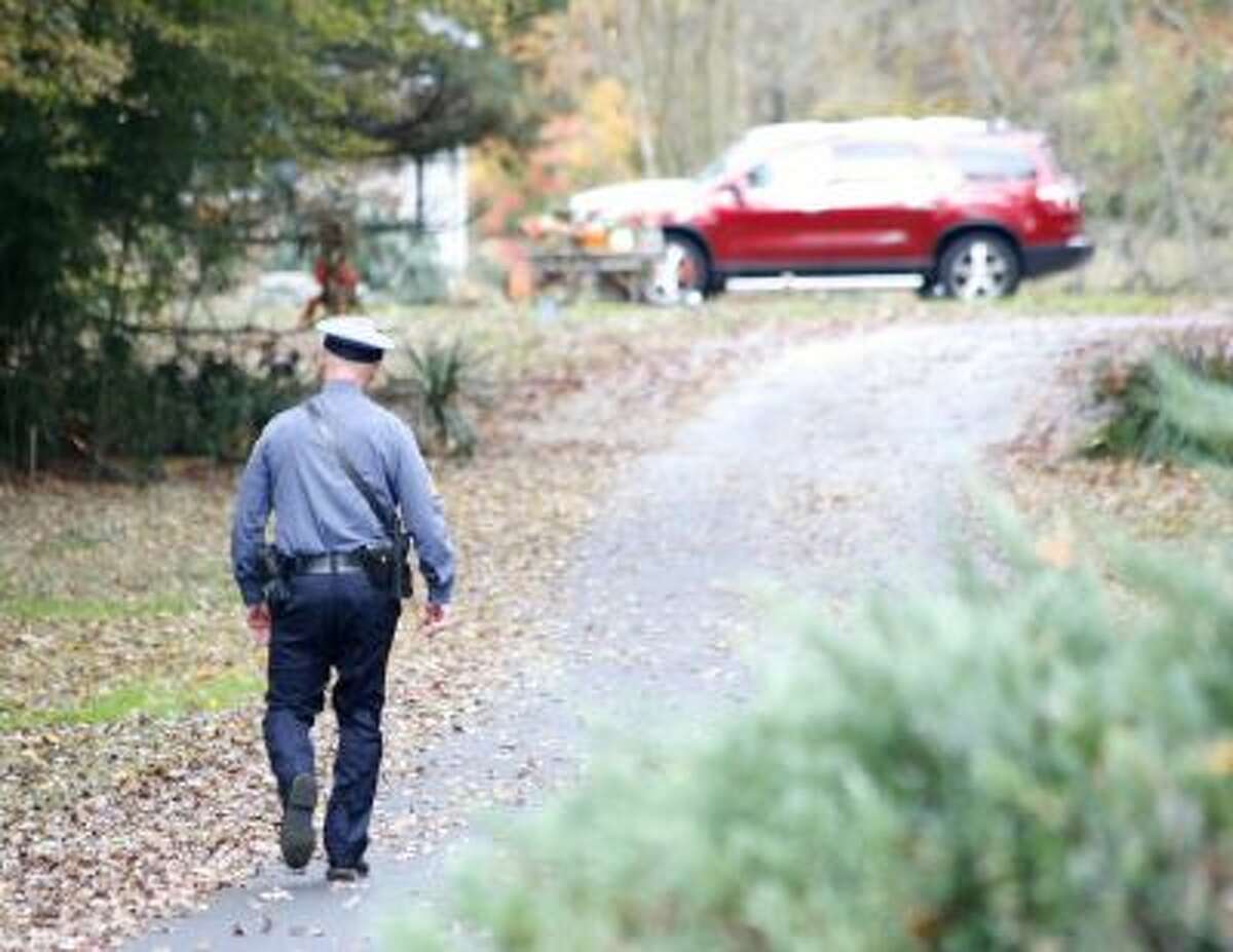 A Pennsville police officer walks up the driveway to the Ciancia home.