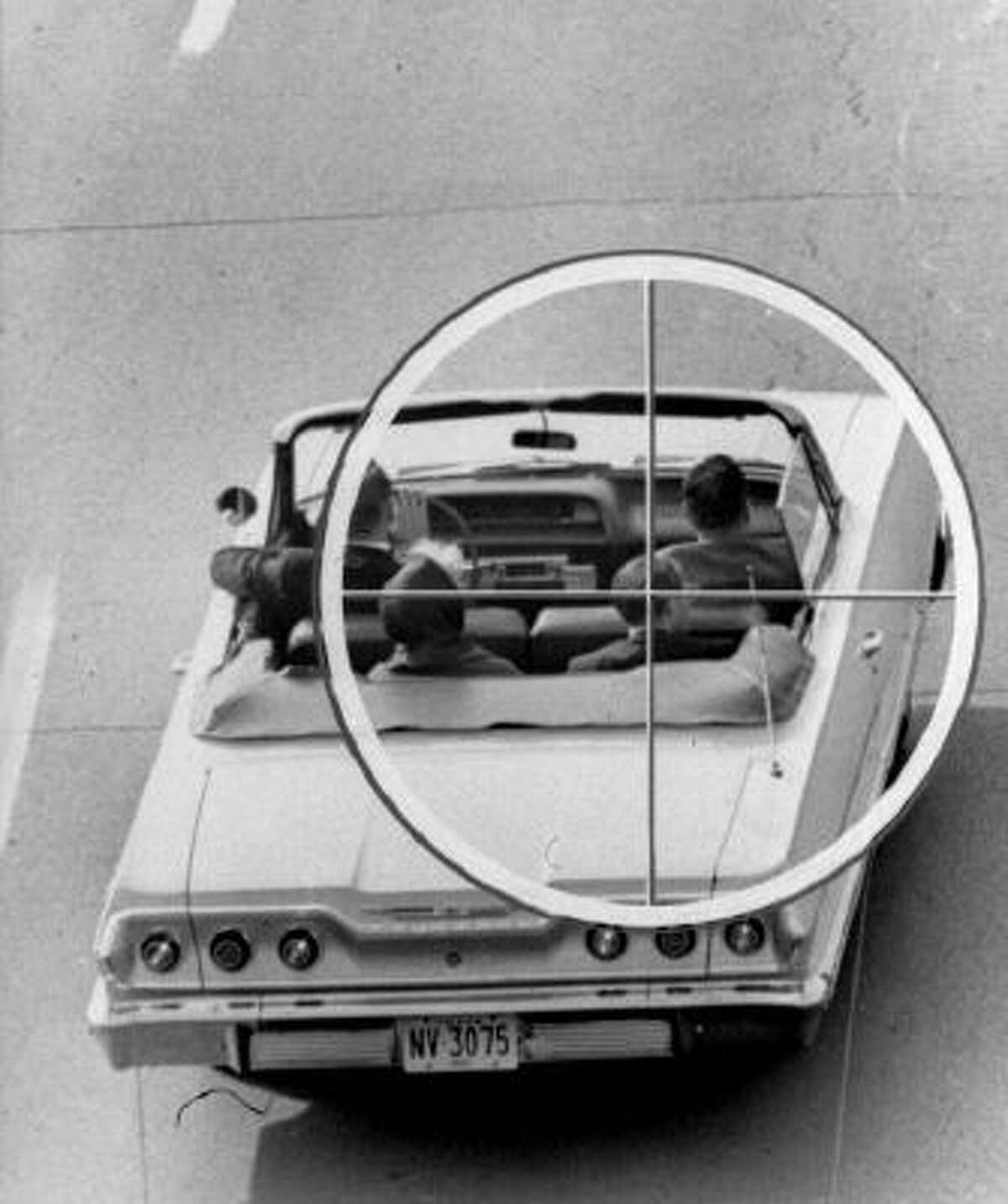 This Nov. 19, 1964 image provided by the Warren Commission shows a reconstruction of the approximate view the assassin of President John Kennedy might have had through the telescopic sight of the rifle fired from the Texas School Book Depository Building on Nov. 22, 1963.