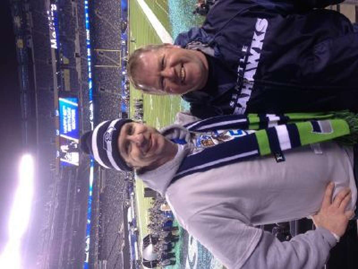 Tom Gish and Mike O'Donnell pose in front of the field at MetLife Stadium after Super Bowl XLVIII.