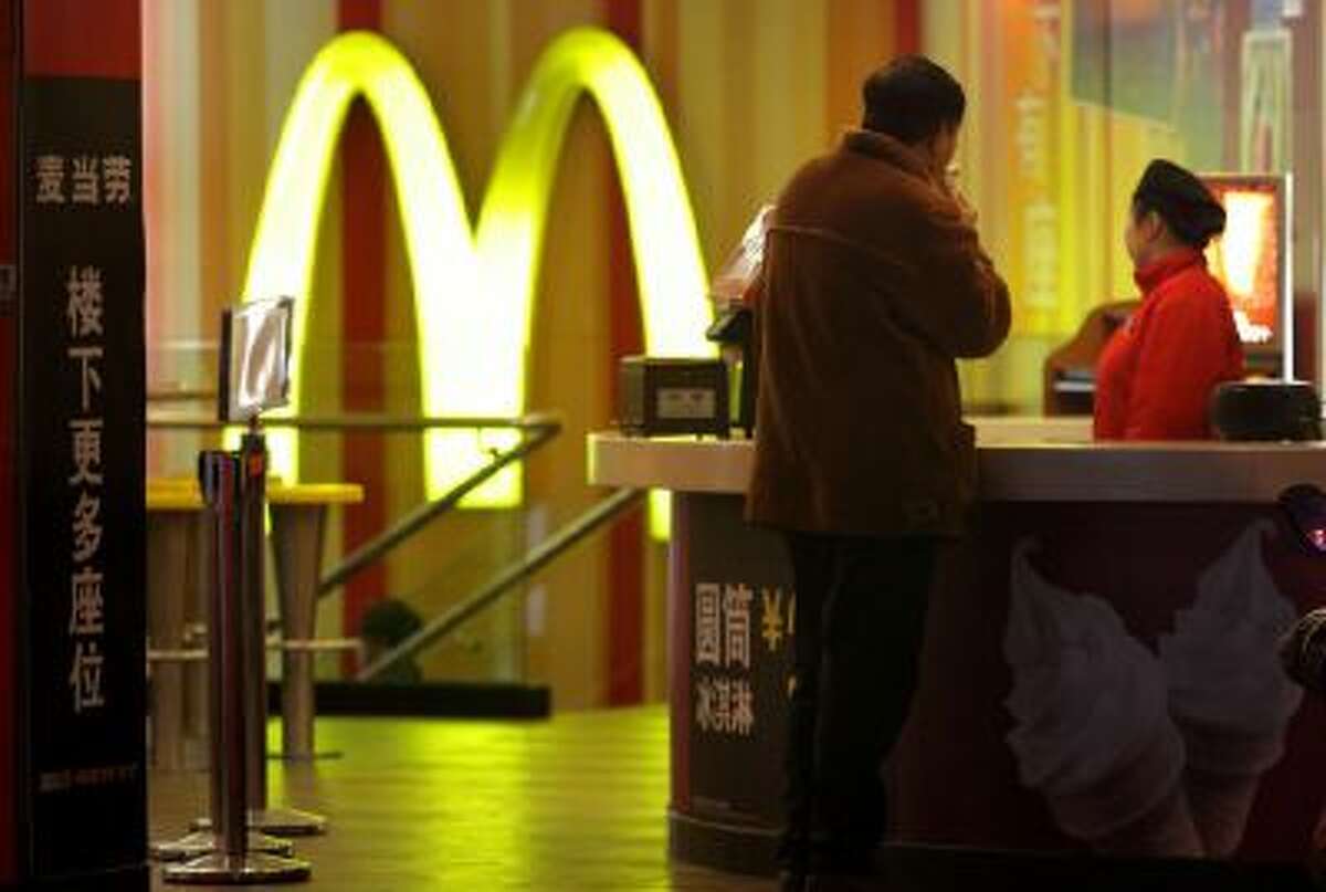 A customer at a McDonald's Shanghai restaurant in February. McDonald's same-store sales fell 3.2 percent in the third quarter, the fourth decline in a row.