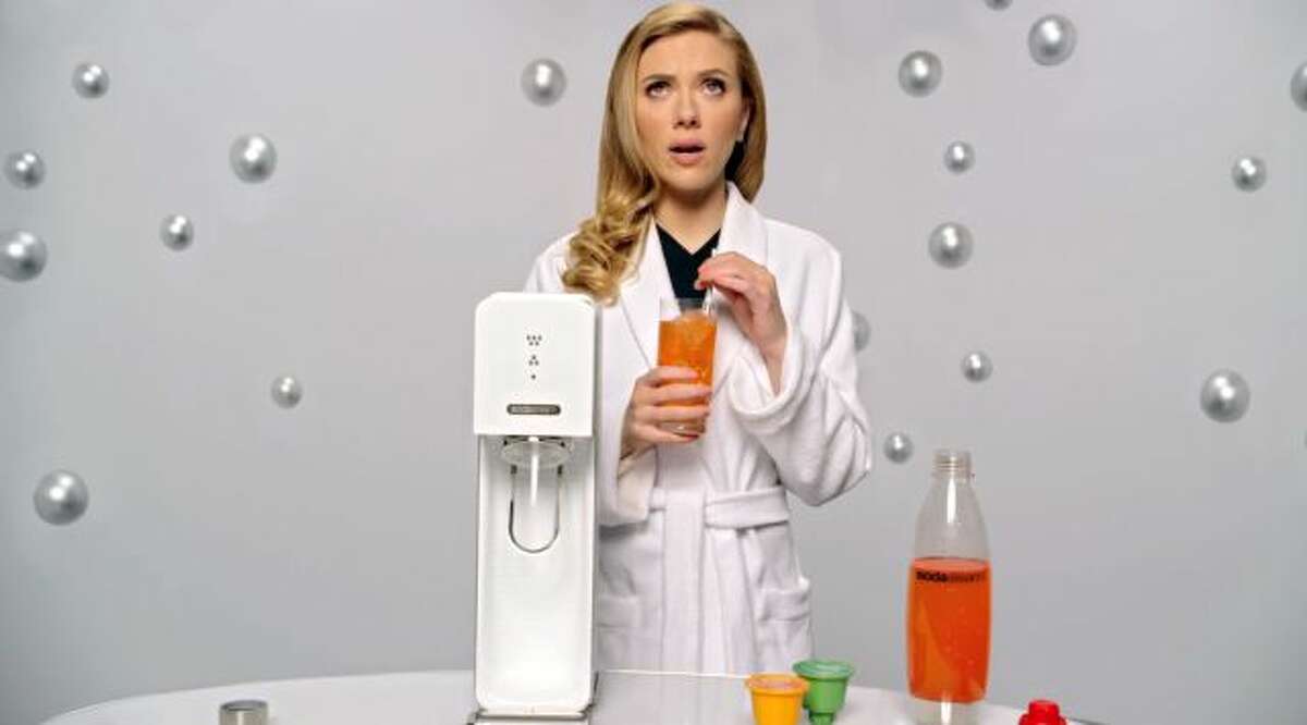 This undated frame grab provided by SodaStream, shows the company's 2014 Super Bowl commercial. SodaStream's ad features "Her" actress Scarlett Johansson promoting its at-home soda maker and will run in the fourth quarter. The ad, which promotes the product as a healthier and less wasteful way to make soda, made waves ahead of the game when the company said it would delete it's last line, "Sorry, Coke and Pepsi," at a request by Fox. (AP Photo/SodaStream)
