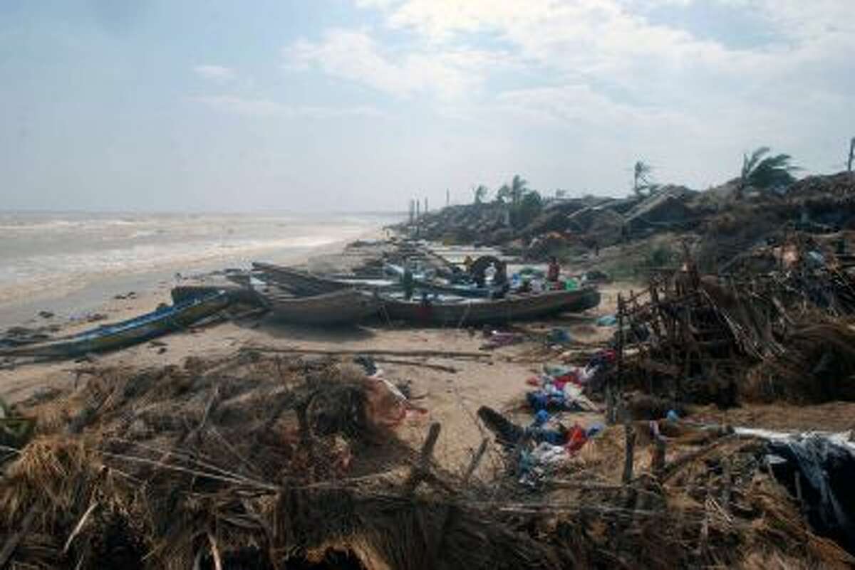 Damaged huts and lashed boats are pictured after Cyclone Phailin made landfall at Padampeta Village, about 200 kilometers south from the eastern Indian city of Bhubaneswar, on October 13, 2013.