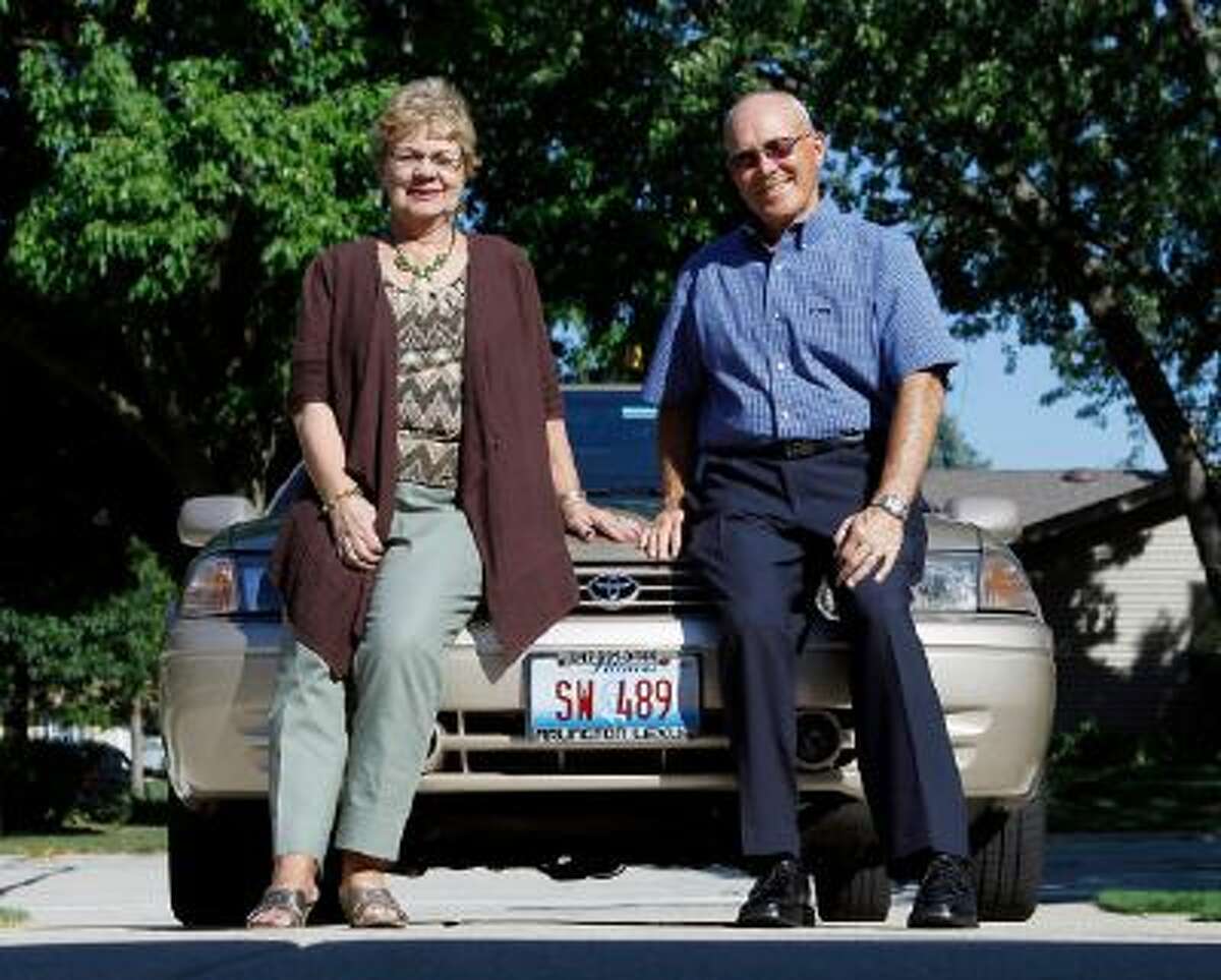 Sandy and Jerry Wiseman pose in the driveway with one of their two cars, in Schaumburg, Ill. The Wisemans took refresher driving classes to help them stay safe behind the wheel for many more years. More older drivers are on the road, and they face a hodgepodge of state licensing rules that reflect scientific uncertainty and public angst over a growing question: How can we tell if it's time to give up the keys?