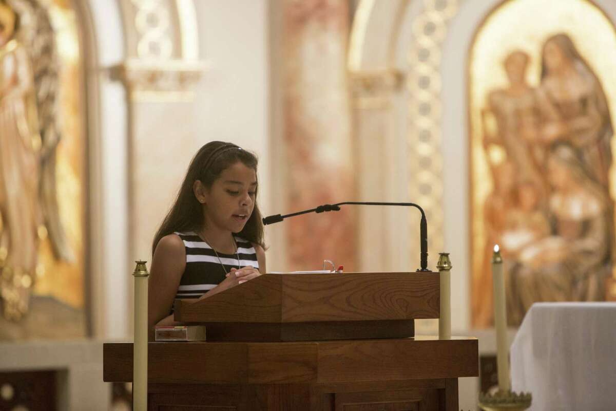 Mia Alcozer, 11, speaks during the partnership celebration Mass for the community health care initiative between Southside ISD and UIW's School of Osteopathic Medicine on Aug. 5, 2017.