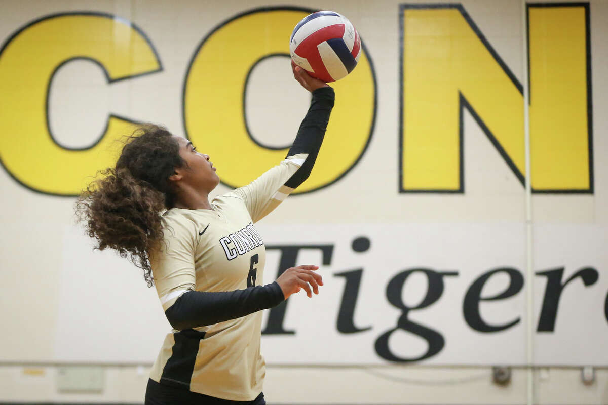Conroe's Jznae Kim (6) tips the ball over the net during the varsity volleyball game against Klein on Monday, Aug. 7, 2017, at Conroe High School. (Michael Minasi / Chronicle)
