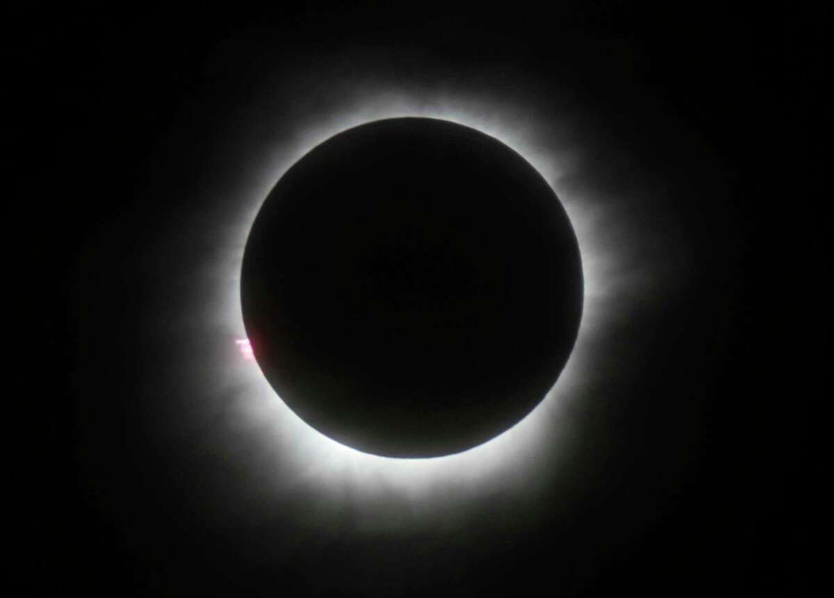 FILE - This March 9, 2016 file photo shows a total solar eclipse in Belitung, Indonesia. Hotel rooms already are going fast in Wyoming and other states along the path of next yearÂ?’s solar eclipse. The total solar eclipse on Aug. 21, 2017, will be the first in the mainland U.S. in almost four decades. (AP Photo, File)
