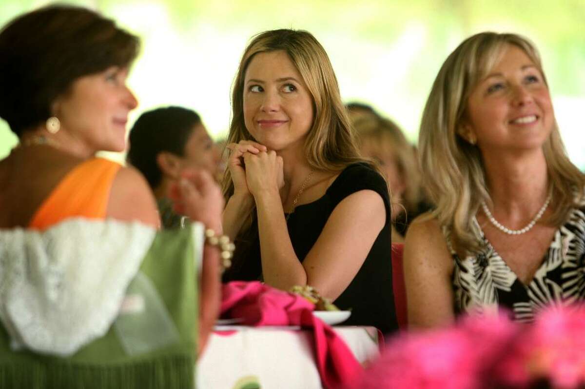 Actress Mira Sorvino, center, sits with Donna Twist, right, executive director of the Norma F. Pfriem Breast Care Center at Bridgeport Hospital, during Wednesday's Rose of Hope luncheon at the home of Tom and Patti Keegan in the Greenfield Hill section of Fairfield.