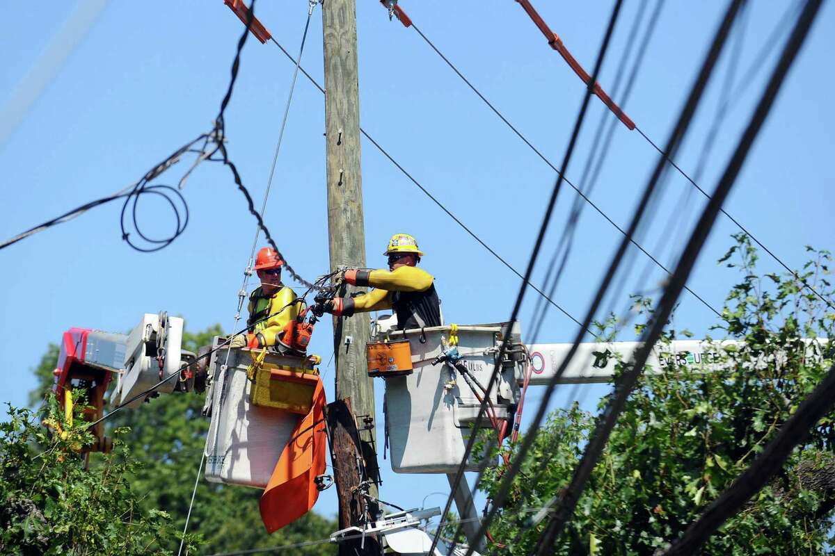 Eversource crews at work in August 2016 in Stamford, Conn., after a utility pole was damaged in a vehicular accident.