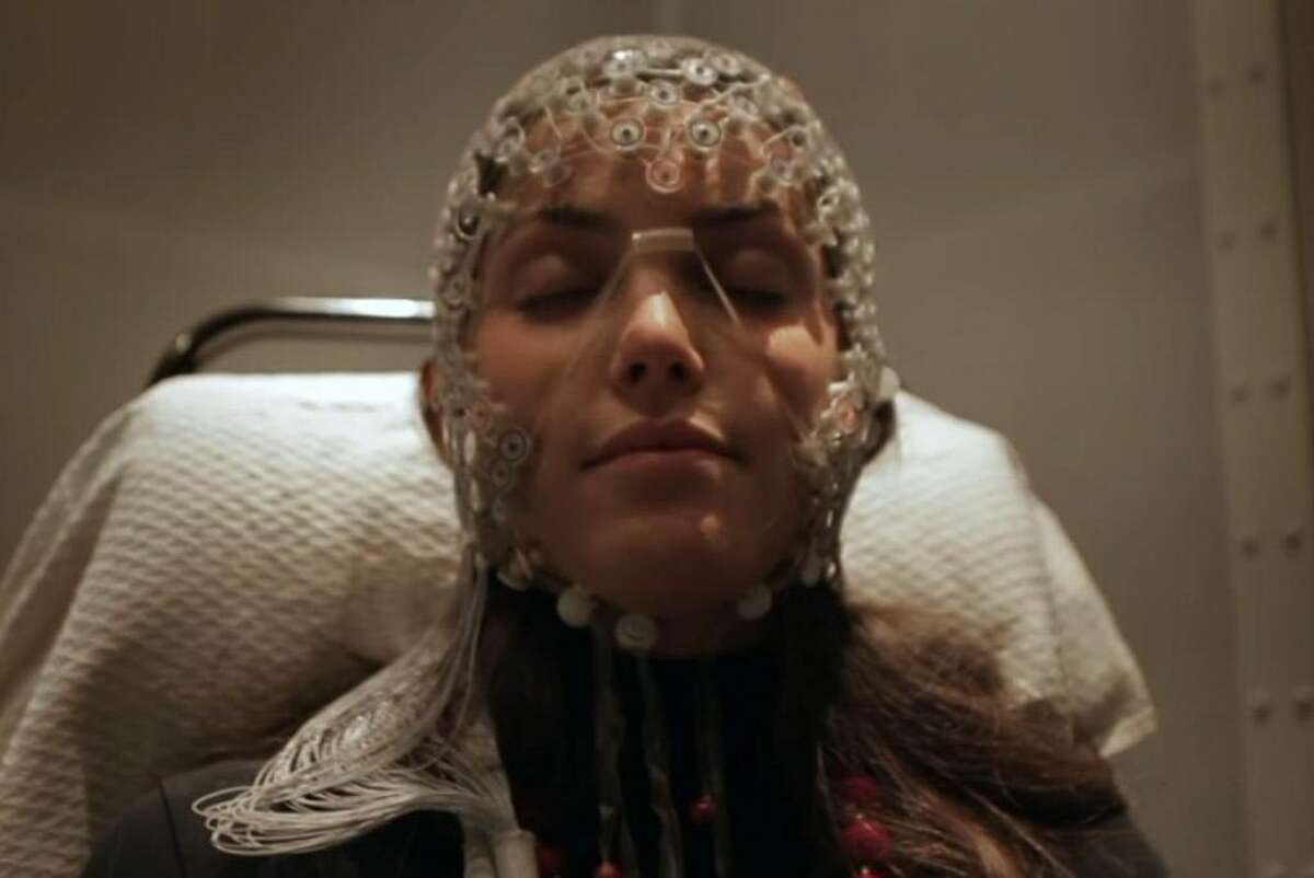 A sleep study participant wearing electroencephalogram sensors.