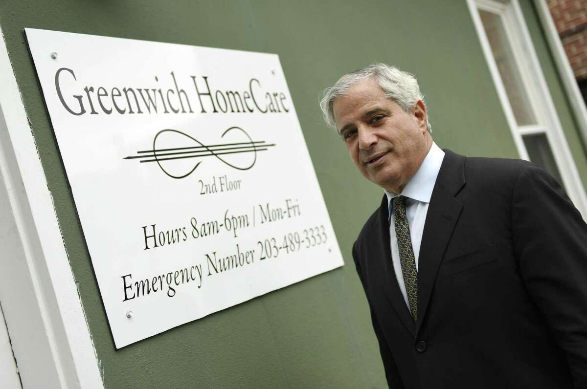 Owner Paul Horowitz poses outside his new business Greenwich Home Care located in downtown Greenwich, Conn. Thursday, Sept. 29, 2016. Horowitz began his company using techniques he found useful when taking care of his wife with cancer.