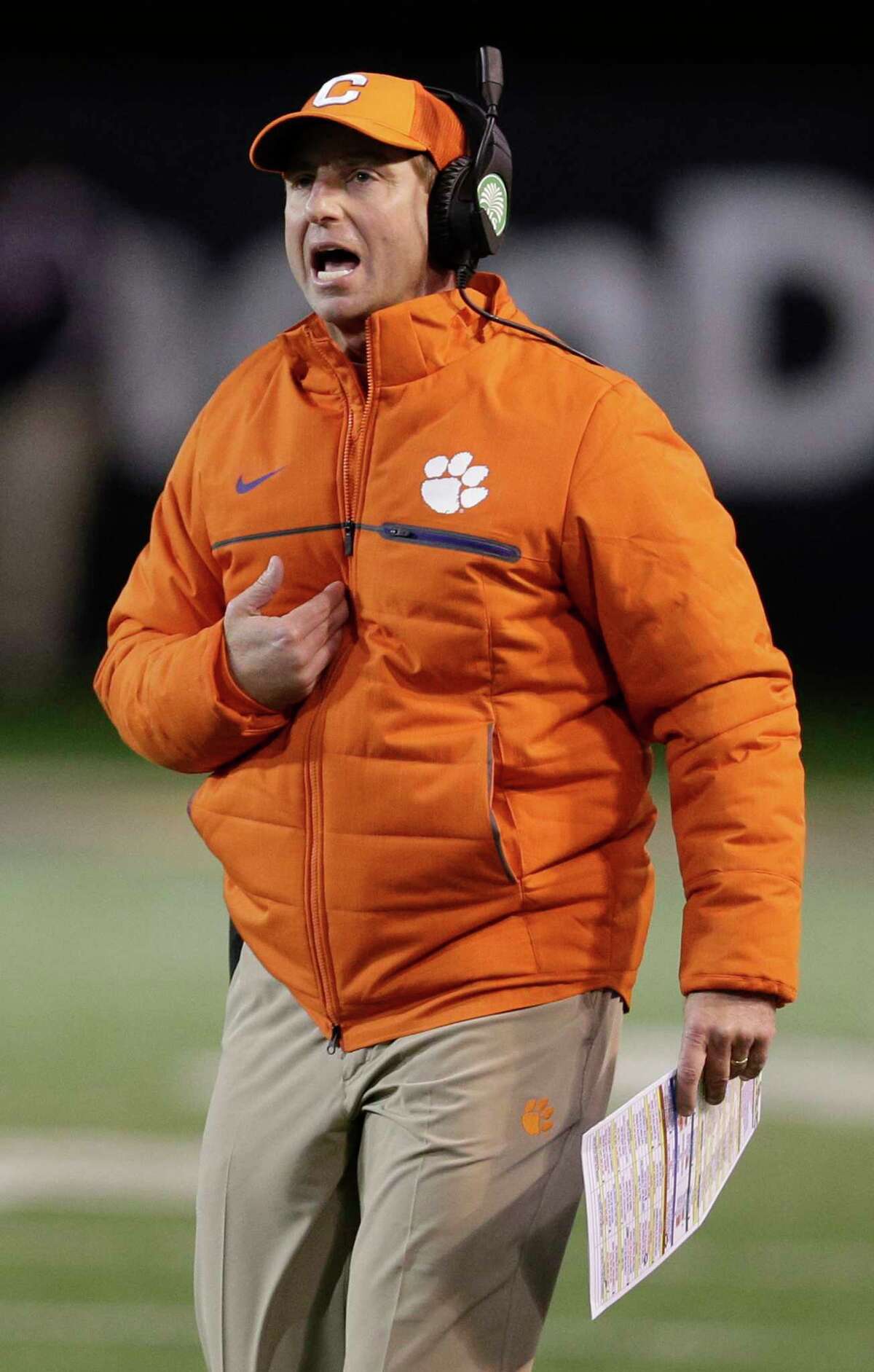 FILE - In this Nov. 19, 2016, file photo, Clemson head coach Dabo Swinney shouts to officials in the first half of an NCAA college football game against Wake Forest in Winston-Salem, N.C. The Tigers enter 2017 as the reigning national champion and a contender for the Atlantic Coast Conference title. (AP Photo/Chuck Burton, File)
