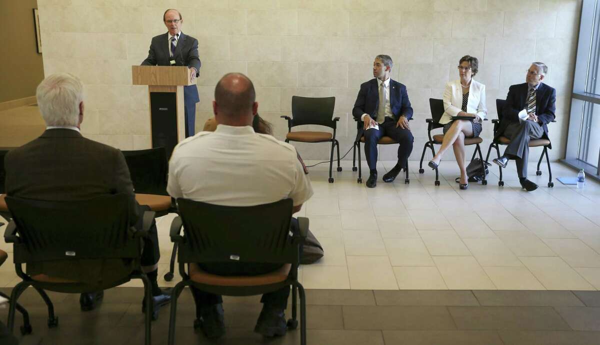 County judge Nelson Wolff speaks Tuesday, Aug. 8, 2017 at the University Health System's Robert B. Green Campus downtown about a recently-formed, county-wide opioid task force formed to try to stay ahead of opioid overdose problems facing other parts of the country. Seated, from left, are San Antonio Mayor Ron Nirenberg, Metropolitan Health District Director Colleen Bridger and University Health System chief medical officer Dr. Bryan Alsip.