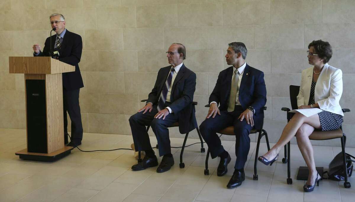 University Health System chief medical officer Dr. Bryan Alsip speaks Tuesday, Aug. 8, 2017 at the University Health System's Robert B. Green Campus downtown about a recently formed, countywide opioid task force formed to try to stay ahead of opioid overdose problems. Seated, from left, are county judge Nelson Wolff, San Antonio Mayor Ron Nirenberg, and Metropolitan Health District Director Colleen Bridger.