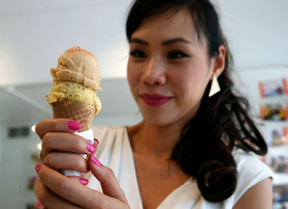 Secret Scoop Thai gelato founder Funn FIsher holds a cone with a double scoop gelato order at her shop on Martin Luther King Jr. Boulevard in Berkeley, Calif. on Saturday, Aug. 5, 2017.