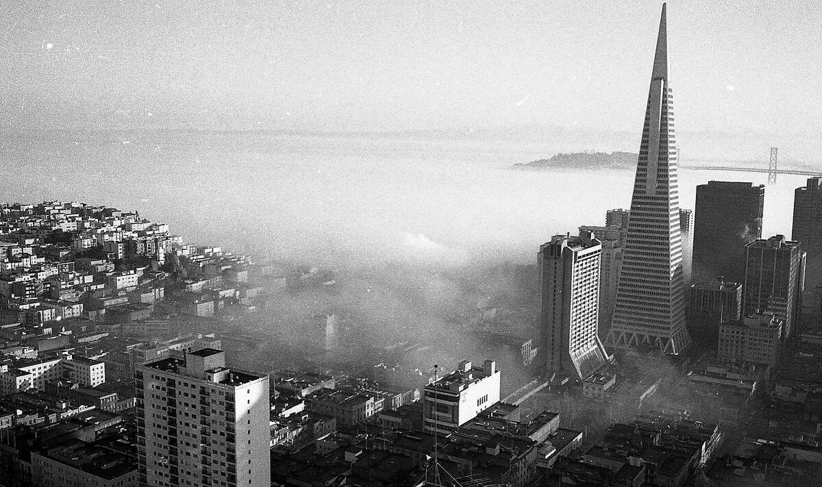 Fog morning in the city around February 13, 1974, including the Transamerica Pyramid and St. Peter & Paul Church