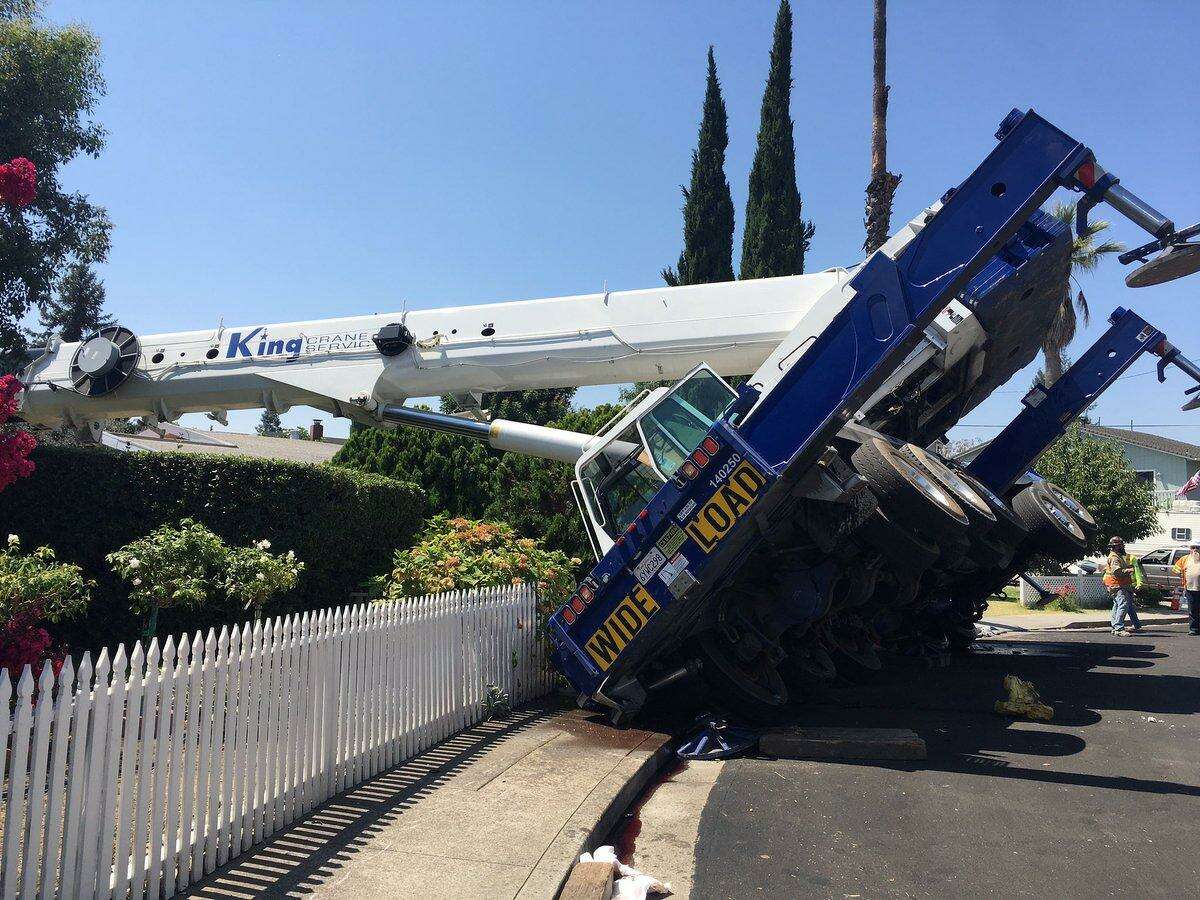 A crane came crashing down on a house in Campbell on Tuesday, police said.