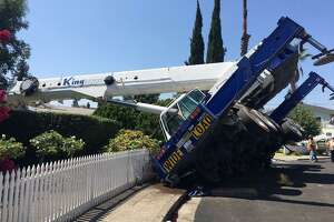 Multi-story crane topples over on Campbell house, police say