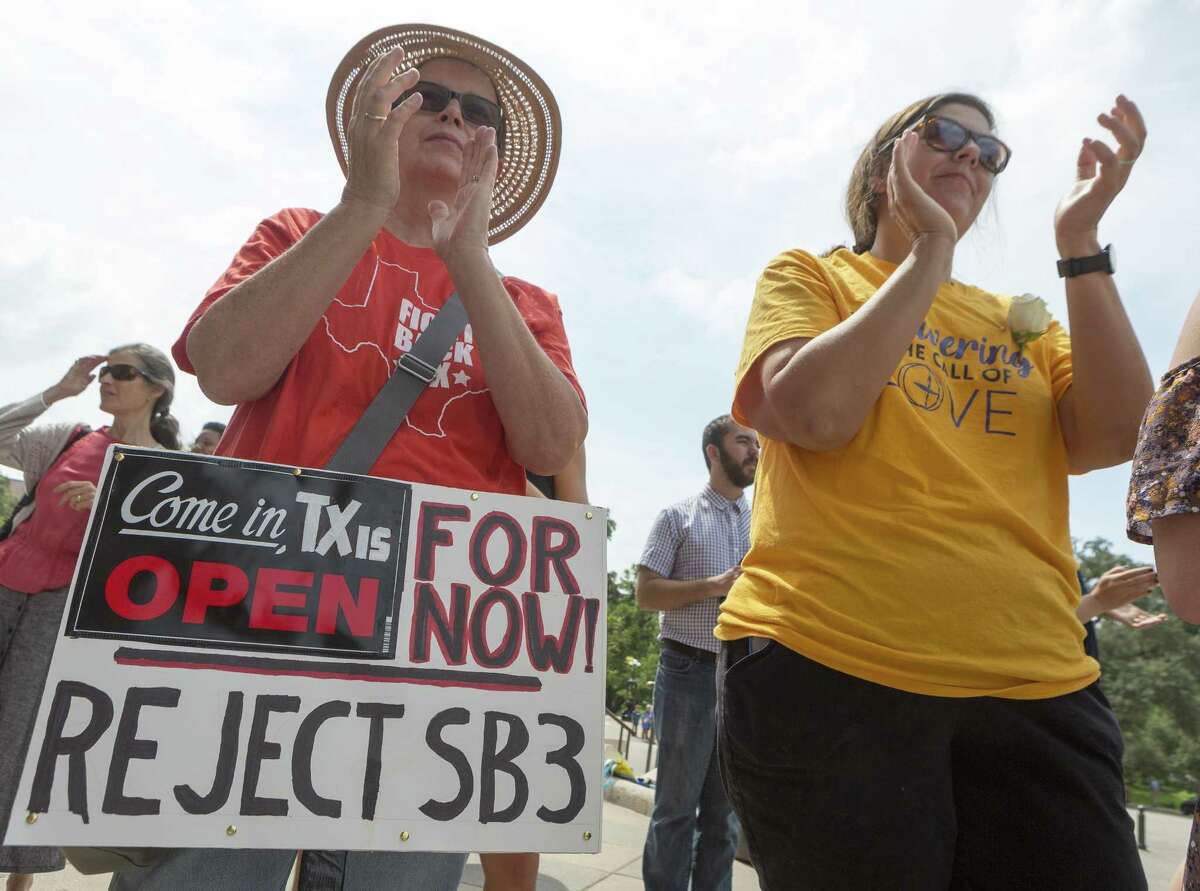 Mercy Lawler, left, and Kristina Borden attend the "Keep Texas Open for Business" event at the Texas Capitol in Austin, Tuesday, Aug. 8, 2017. Those in attendance urged the Texas Legislator to reject the bathroom bill. (Stephen Spillman / for Express-News)