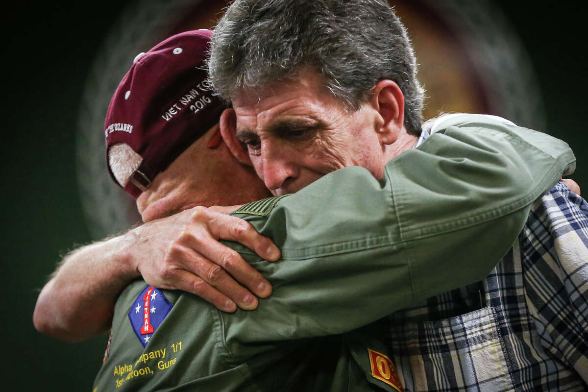 Vietnam Veteran Eddie Neas, left, embraces Magnolia resident Brian Dale Freed, right, as he becomes overwhelmed with emotion during a ceremony on Tuesday, Aug. 8, 2017, at Magnolia City Hall.
