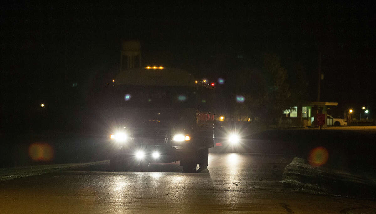 The first bus that is moving heat-sensitive inmates to other facilities leaves the Wallace Pack Unit at around 5 a.m. Wednesday, Aug. 9, 2017, in Navasota. The inmates will be sent to 11 other facilities. ( Yi-Chin Lee / Houston Chronicle )