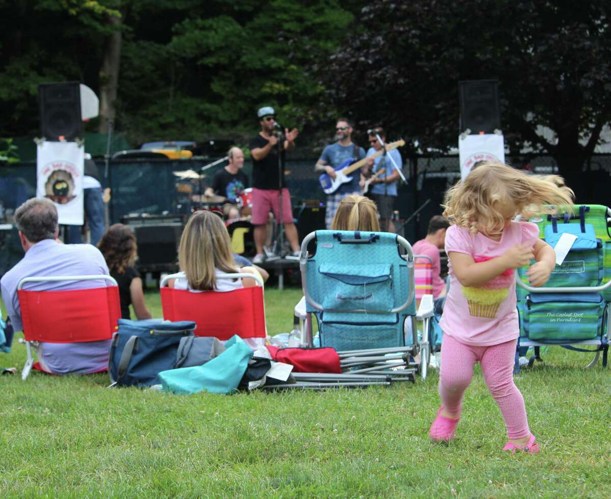 Lexi dances to One Bad Oyster during the final night of Wilton's summer concert series on Sunday, Aug. 6, 2017, at Merwin Meadows.