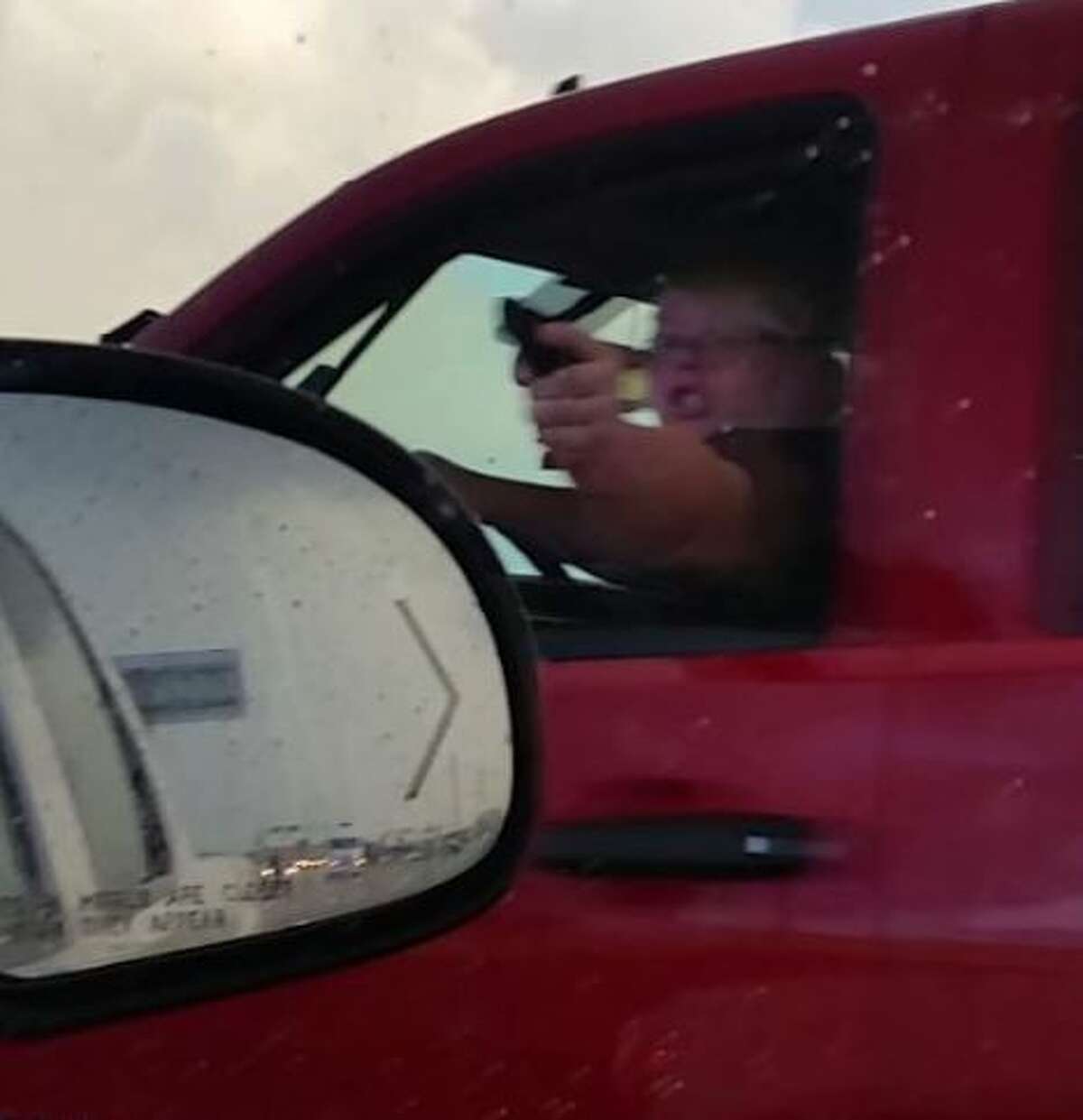 La Porte police report Amanda Downs, 25, was photographed pointing what appears to be a handgun at another driver in an apparent road rage incident. 