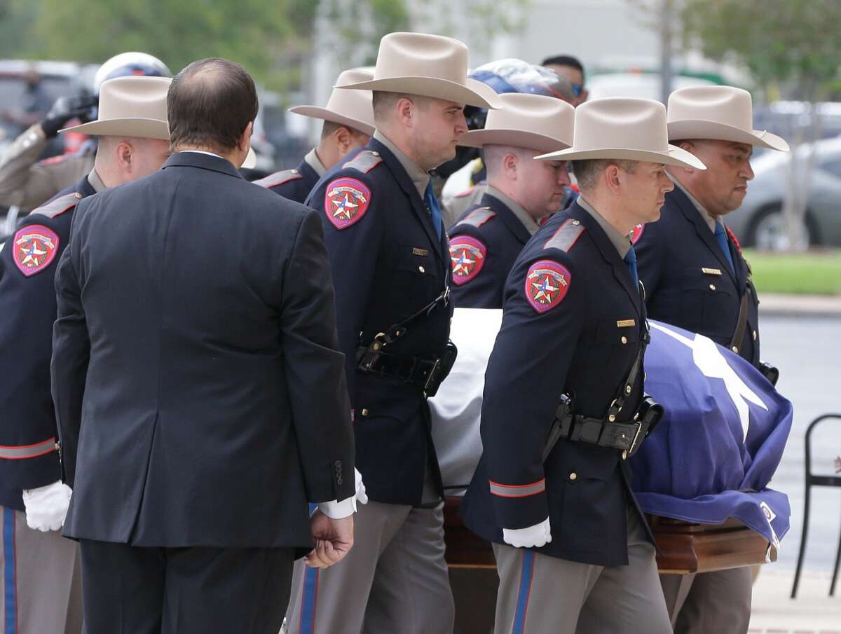 Texas Dept. Public Safety Honor Guard members escort the casket for the memorial service for former Texas Governor Mark White at Second Baptist Church, 6400 Woodway, Wednesday, August 9, 2017. ( Melissa Phillip / Houston Chronicle )