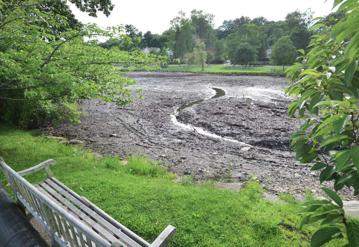 The main part of Binney Park Pond is nearly drained as the dredging operation continues at the pond in the Old Greenwich section of Greenwich. Town officials have said the dredging and restoration project of Binney Park Pond that started July 5th should be completed in 6 months, sometime in the spring of 2018.