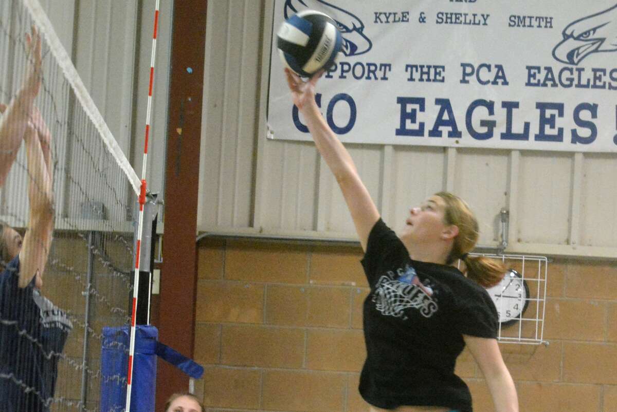 Plainview Christian Academy's Kylee Hill tips the ball over the net during a recent volleyball practice. Hill is one of three seniors on a veteran team that is hoping to make a run to the TAPPS state tournament this year.