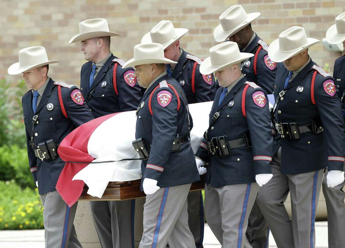 Texas Dept. Public Safety Honor Guard members escort the casket from the memorial service for former Texas Governor Mark White at Second Baptist Church, 6400 Woodway, Wednesday, August 9, 2017. ( Melissa Phillip / Houston Chronicle )