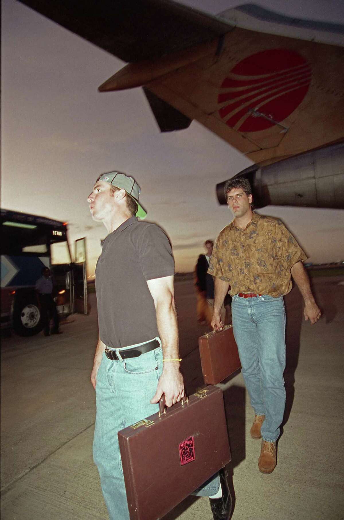 08/23/1992 - (L-R) Houston Astros Casey Candaele and Ken Caminiti disembark from the Astros' team plane at Hobby Airport on Sunday night. The Astros completed their longest road trip in franchise history, 26 games in 28 days, made necessary because the Republican National Convention took over the Astrodome for the month.