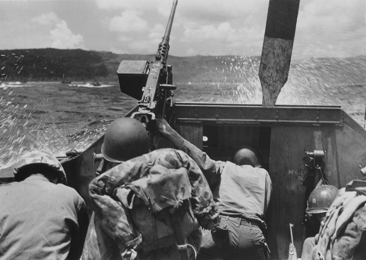 Guam- July 20: American Marines ducking below gunwales while approaching Ascan Point beaches in small landing craft during the fighting against Japanese forces for Asan Point.