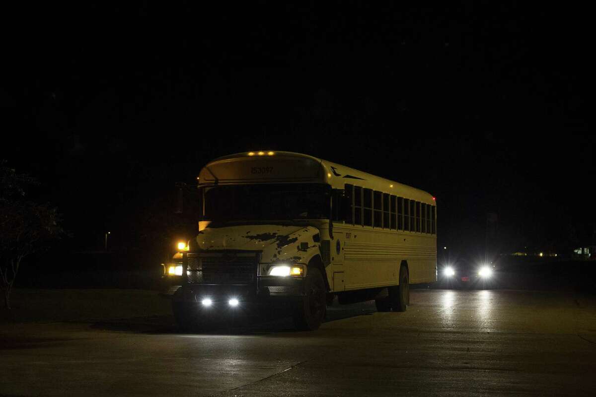 The first bus moving heat-sensitive inmates to other facilities leaves the Wallace Pack Unit at around 5 a.m. Aug. 9 in Navasota. The inmates will be sent to 11 other facilities. A court ruling made this possible.
