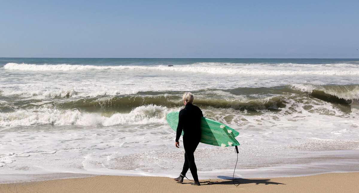 Mark Massara, one of the attorneys representing the Surfrider Foundation, is ready to surf at Martin's Beach in Half Moon Bay, Calif. on Thursday, Sept. 25, 2014, one day after a judge ordered landowner Vinod Khosla to unlock a private gate and allow public access to the beach.
