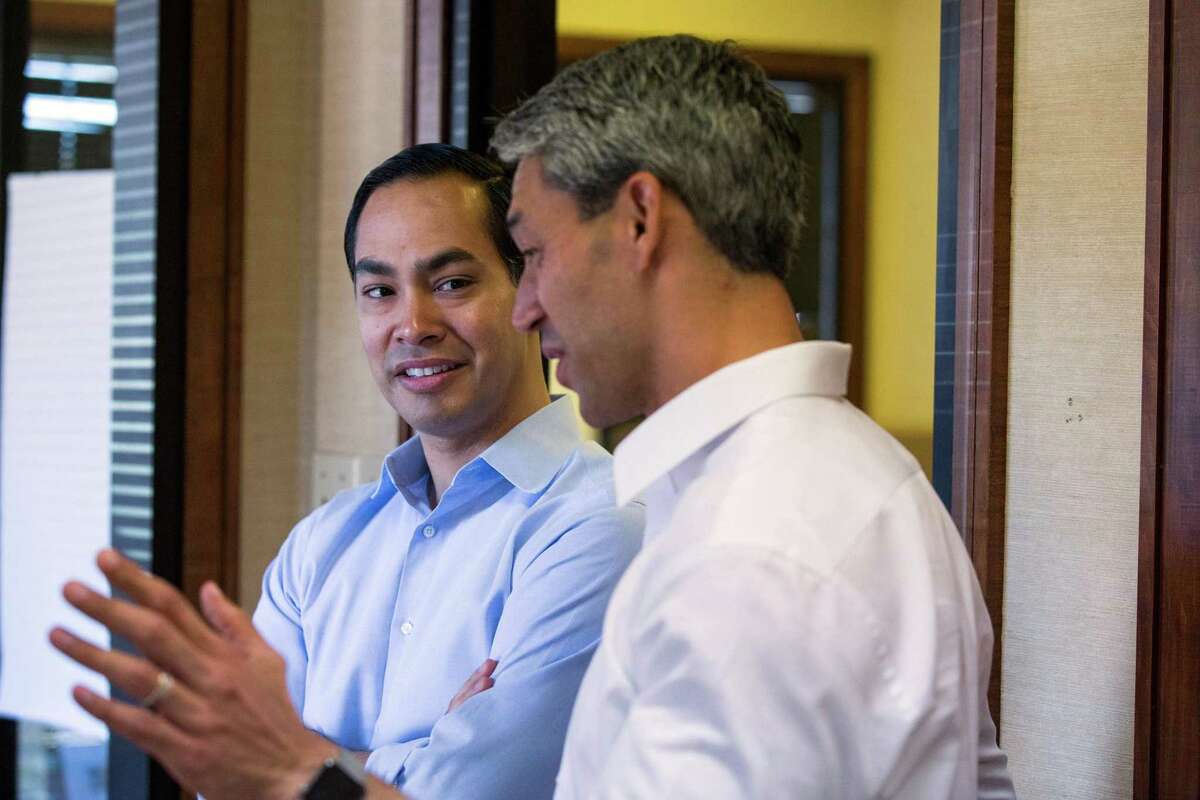 Mayoral candidate Ron Nirenberg speaks with former San Antonio Mayor Julian Castro at Nirenberg's campaign headquarters in San Antonio, Texas on May 13, 2017. Castro publicly endorsed Nirenberg on Saturday. Ray Whitehouse / for the San Antonio Express-News