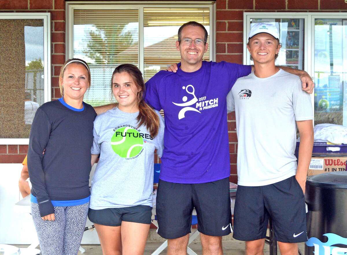 From left to right, Emily Cimarolli, Emma Lipe, Kirk Schlueter and Jack Desse pose for a photo at the EHS Tennis Center before the start of the USTA Edwardsville Futures Tournament.