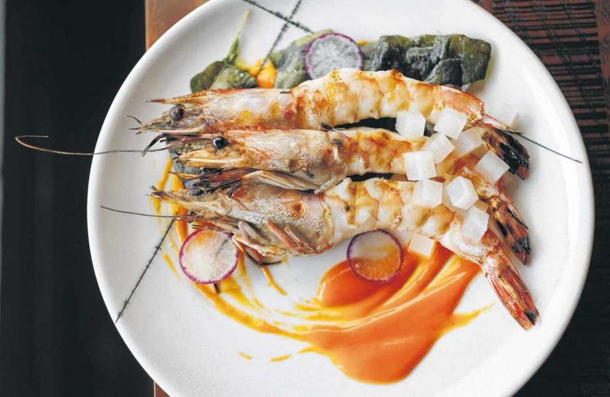 Riel Entree price: $$$2017 rank: 25 Cuisine: Contemporary American Where: 1927 Fairview Phone: 832-831-9109 Website: rielhtx.com  Read Alison Cook's review of Riel  Pictured above: Gulf shellfish with hot-and-sour sauce and collard greens