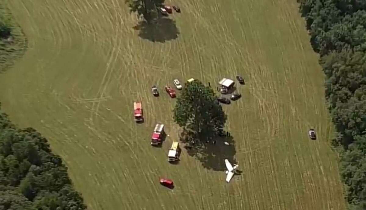 A man is dead and two people are injured after a plane from Danbury Municipal Airport crashed at Candlelight Farms Airport in New Milford, Conn. on Friday, August 11, 2017.