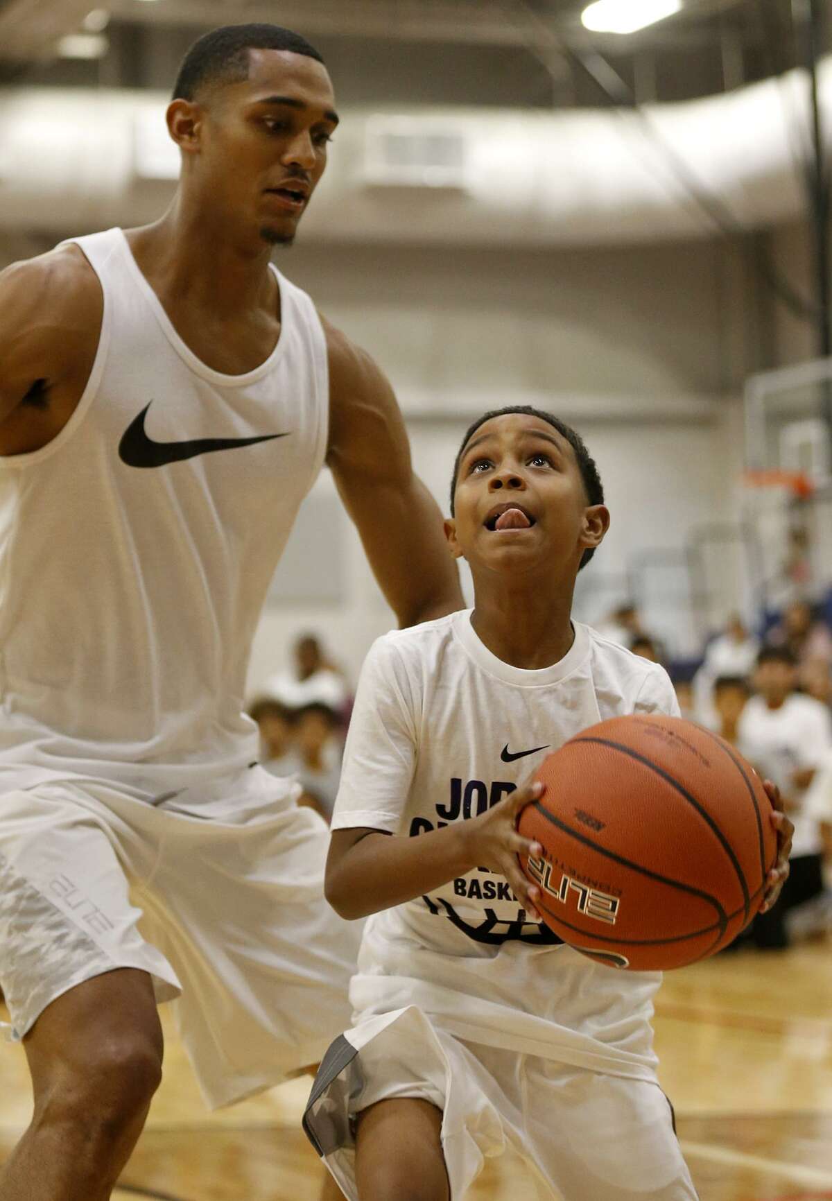 Los Angeles Lakers’ Jordan Clarkson defends Jaylen Williams, 12, during a dual basketball clinic with the Oklahoma City Thunder’s Andre Roberson (not pictured) on Aug. 4, 2017 at Veterans Memorial High School.