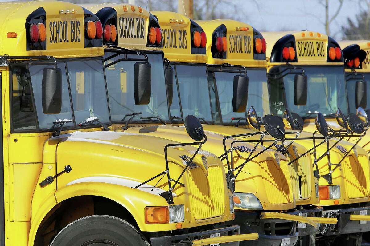 In this file photo, public school buses are parked in Springfield, Ill. Once upon a time, finding out how your child was doing in school could require weeks of patience. You waited for the parent-teacher conference, for a return phone call from school if you were concerned and, eventually, for a report card to land in the mailbox. Now, a growing number of families can get instant access to grades and other school information through online parent portals.