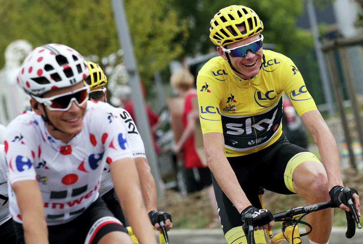 Britain’s Chris Froome, wearing the overall leader’s yellow jersey, and France’s Warren Barguil, wearing the best climber’s dotted jersey, ride during the twenty-first and last stage of the Tour de France cycling race over 103 kilometers (64 miles) with start in Montgeron and finish in Paris, France on July 23, 2017.
