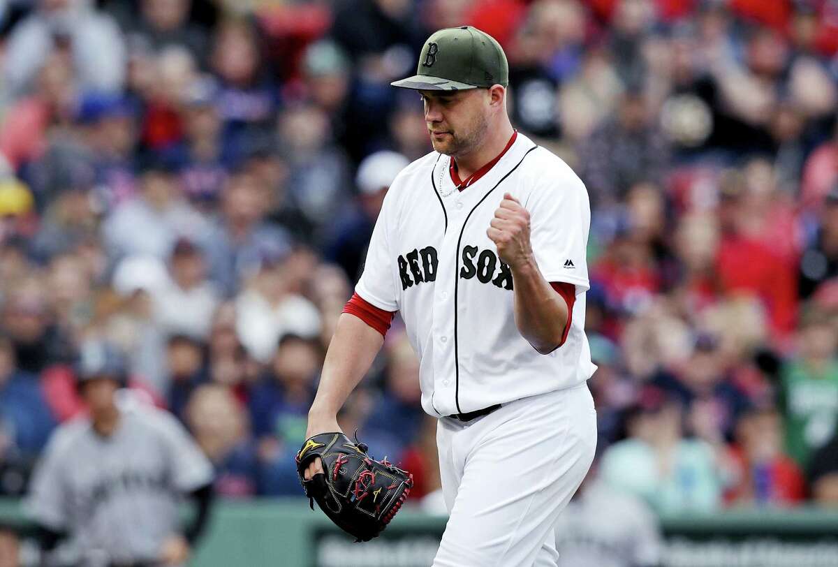 Red Sox starting pitcher Brian Johnson pumps his fist after completing the top of the eighth inning on Saturday.