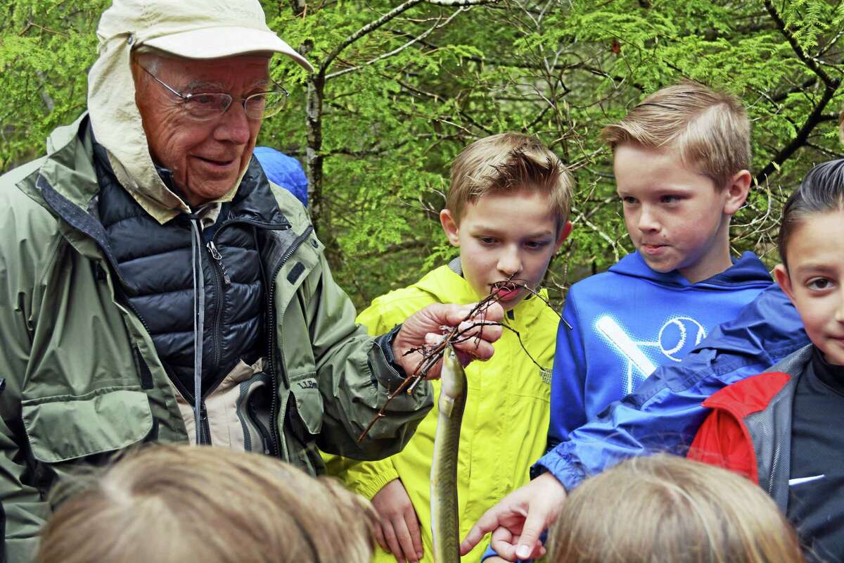 Center Elementary School fourth-grade students of Jeremy Moore and Shawn Quinn began a salmon hatch-and-release study in December after Gary Bogli from the Connecticut River Salmon Association delivered 300 fish eggs in December. Here, Bogli explains the similarity between the life cycles of the American eel and Atlantic salmon.