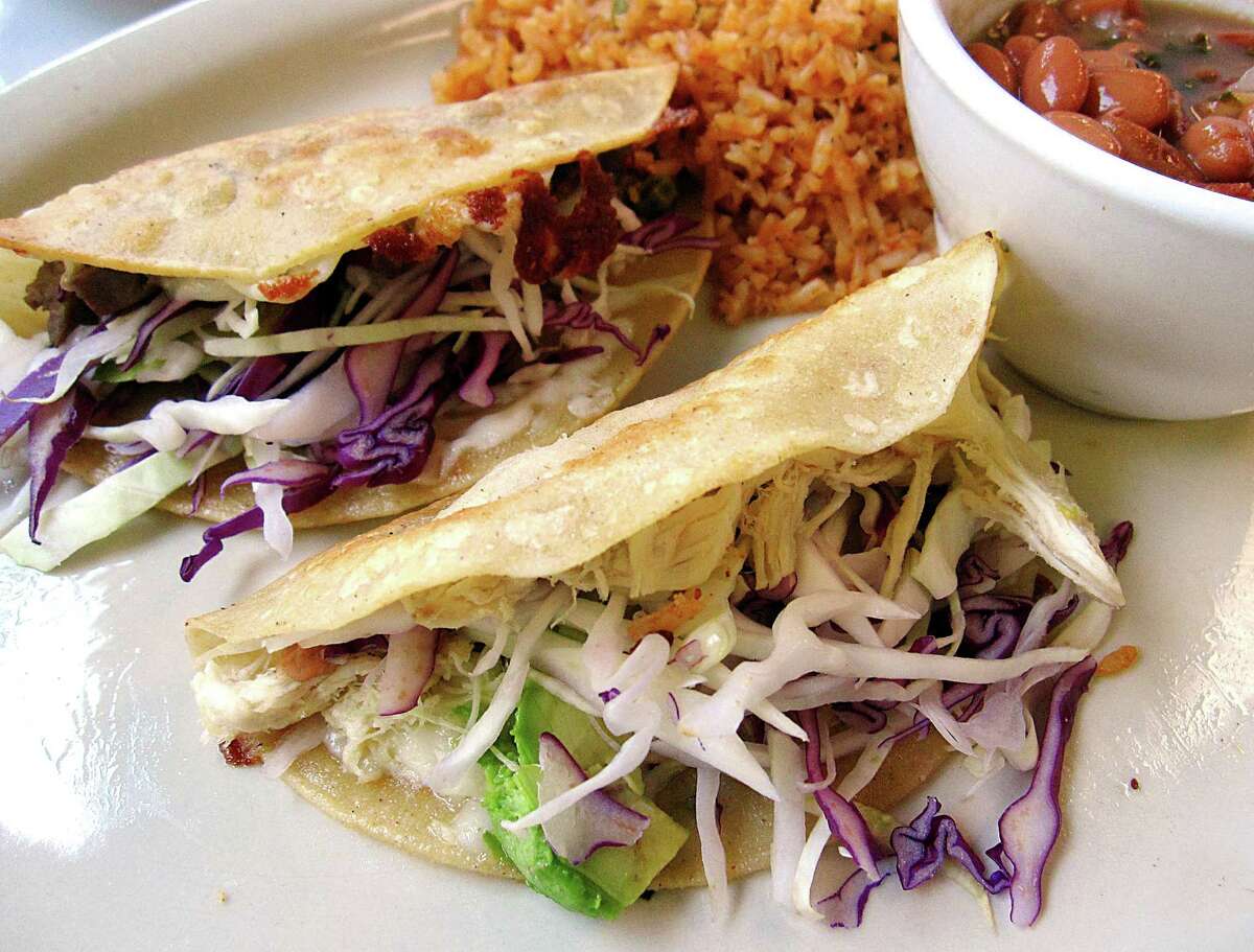 Beef and chicken tacos with beans and rice make up the Tacos a la Parrilla platter from Soluna.