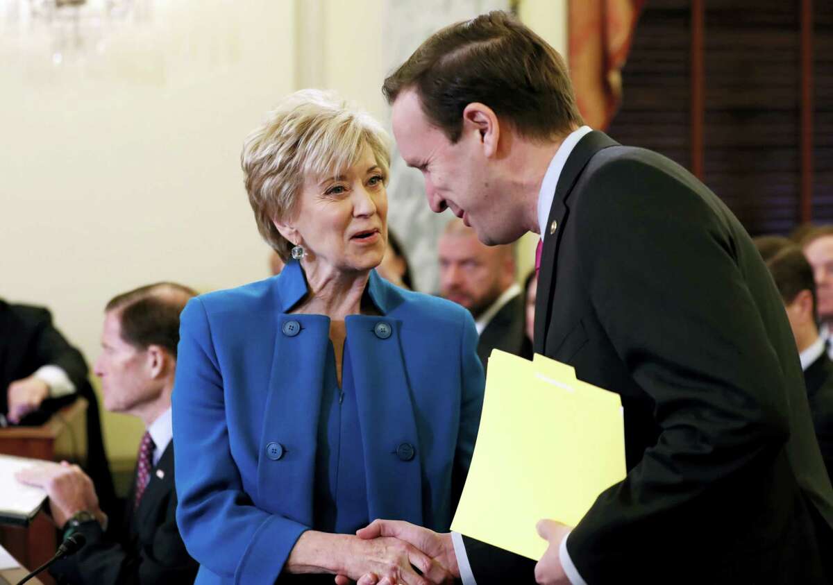Small Business Administration Administrator-designate, former wrestling entertainment executive, Linda McMahon shakes hands with U.S. Sen. Chris Murphy, D-Conn., on Capitol Hill in Washington, Tuesday, Jan. 24, 2017, prior to her confirmation before the Senate Small Business and Entrepreneurship Committee.