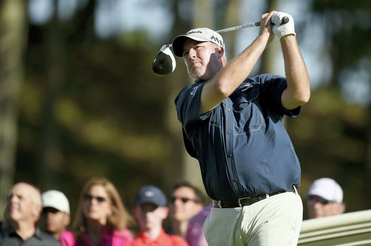 Boo Weekley watches his tee shot on the 18th hole during the third round of the Travelers Championship on Saturday.